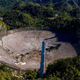 Aerial footage showing the damaged dish at the Arecibo Observatory and three support towers.